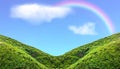 Green Mountain Slope With Rainbow In Blue Sky