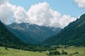 Green mountain valley landscape with river and cloudy sky Royalty Free Stock Photo
