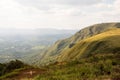 Green mountainous landscape with partially clouded sky Royalty Free Stock Photo