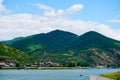 Green mountains on Danube beach.