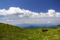 Green mountains panorama under blue sky on bright sunny day. Tourism and traveling concept, copy space background Royalty Free Stock Photo