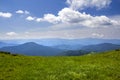 Green mountains panorama under blue sky on bright sunny day. Tourism and traveling concept, copy space background Royalty Free Stock Photo