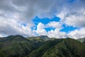 Green mountains panorama under cloudy sky spectacular landscape. Rural land scenery. Summer travel hiking in green hills Royalty Free Stock Photo