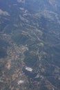 Green mountains seen from the window of an airplane Royalty Free Stock Photo