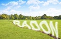 A green mowed lawn with a diagonal crack with radon gas escaping - concept image with copy space