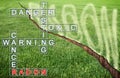 A green mowed lawn with a diagonal crack with radon gas escaping - concept image with crossword puzzle