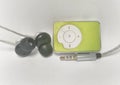 Green mp3 player with a earphone and audio jack