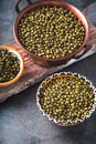 Green mung beans in bowls on wooden stand partial blur Royalty Free Stock Photo