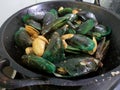 Green mussels and batik clams cooked in tomato sauce, soy sauce and oyster sauce. Simple home cooking.