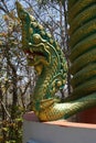 Green naga serpent on column