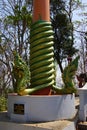 Green naga serpent on column