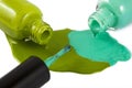 green nail polish bottle with splatters isolated Royalty Free Stock Photo