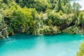 Green Natural Environment full of Waterfalls in Plitvice Lakes National Park, Croatia. Waters Falling into the Blue Lake Royalty Free Stock Photo