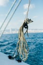 Green nautical rope inside pulley on boat