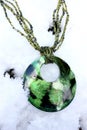 Green necklace in the snow