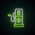 Green neon charging station sign.