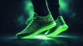 Green neon sneakers on a black background with copy space for text or design. A close up of a pair of walking shoes. Fashion