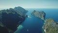 Green nobody wild nature landscape of tropic island at ocean bay aerial view. Mountainous isle