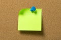 Green note pad attached to corkboard Royalty Free Stock Photo