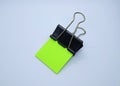 Green note paper with black binder clip. Binder clip and stack of green note paper Royalty Free Stock Photo