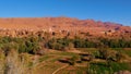 Green oasis with fields and date palm trees in the southern Altas Mountains in Berber city Tinghir, Morocco. Royalty Free Stock Photo