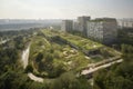 green oasis in the middle of urban landscape, including green parks and organic farms