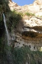 A green oasis with a waterfall and lakes in the Ein Gedi National Park in Israel on the Dead Sea Royalty Free Stock Photo