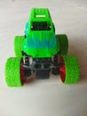 Green off-road toy car seen from the front Royalty Free Stock Photo