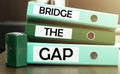 3 green office folders with text Bridge The Gap Royalty Free Stock Photo