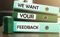 3 green office folders with text We Want Your Feedback Royalty Free Stock Photo