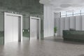 Green office lobby interior lifts and marble reception desk with pc computer Royalty Free Stock Photo