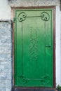 Green old door with a key lock, close-up Royalty Free Stock Photo