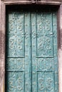 Green old door with patterns