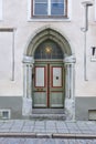 Green old fashioned wooden door on colored facade. Tallinn Royalty Free Stock Photo