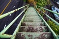 Green old rusted stairs going down