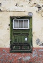 green old shabby window in a decaying house Royalty Free Stock Photo