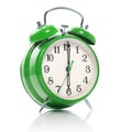 green old style alarm clock on white
