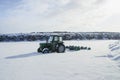 Green old tractor farm machine vehicle stuck in snow winter panorama nature landscape North Iceland Europe Royalty Free Stock Photo