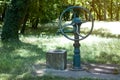 Green old water well and pump for water Royalty Free Stock Photo