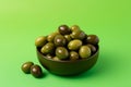 Green olives bowl background. Generate Ai Royalty Free Stock Photo