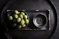 Green olives in a ceramic bowl on a wooden background. Royalty Free Stock Photo