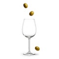 Green Olives Falling into Empty Wine Glass Isolated on White Royalty Free Stock Photo
