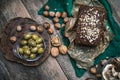 Green olives, nuts mushrooms and bread with seeds Royalty Free Stock Photo