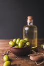 Green olives, sliced ciabatta, feta cheese on a wooden board. Olive oil in a glass bottle. Royalty Free Stock Photo
