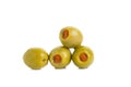 Green olives stuffed with red paprika isolated on white Royalty Free Stock Photo