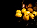 Green olives in a tin can on a black background Royalty Free Stock Photo