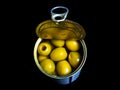 Green olives in a tin can on a black background Royalty Free Stock Photo