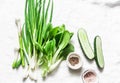 Green onions, garlic, cabbage bok choi, cucumbers - fresh green vegetables on a white background, top view. Copy space Royalty Free Stock Photo