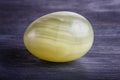 Green onyx egg on a black background Royalty Free Stock Photo