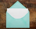 Green open envelope with blank paper. Royalty Free Stock Photo